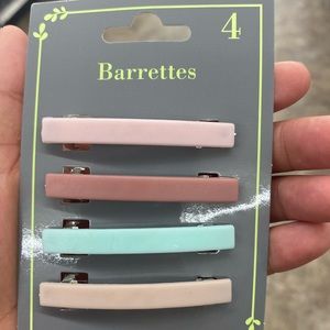 2 packs of barrettes, different colors and brand new